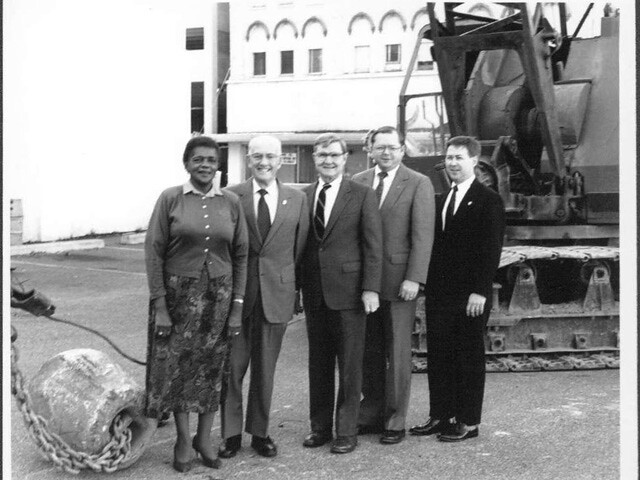 Expanding Downtown: Trustees pose on the site of the future Kalamazoo Valley downtown campus and future museum site (1992).