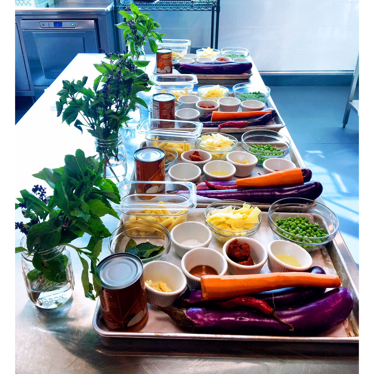 Colorful veggies and dips on serving trays.