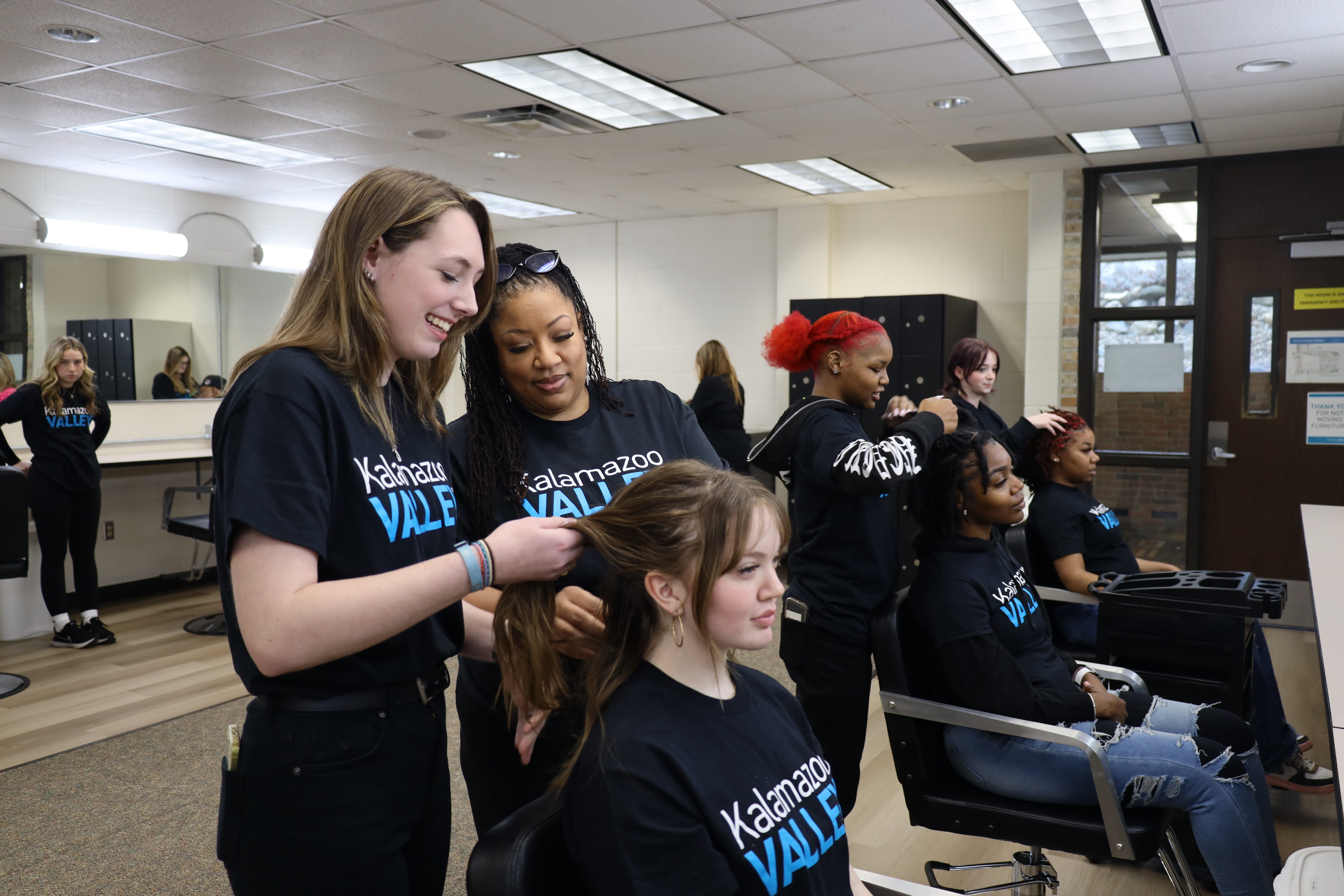 Picture of students practicing styling hair