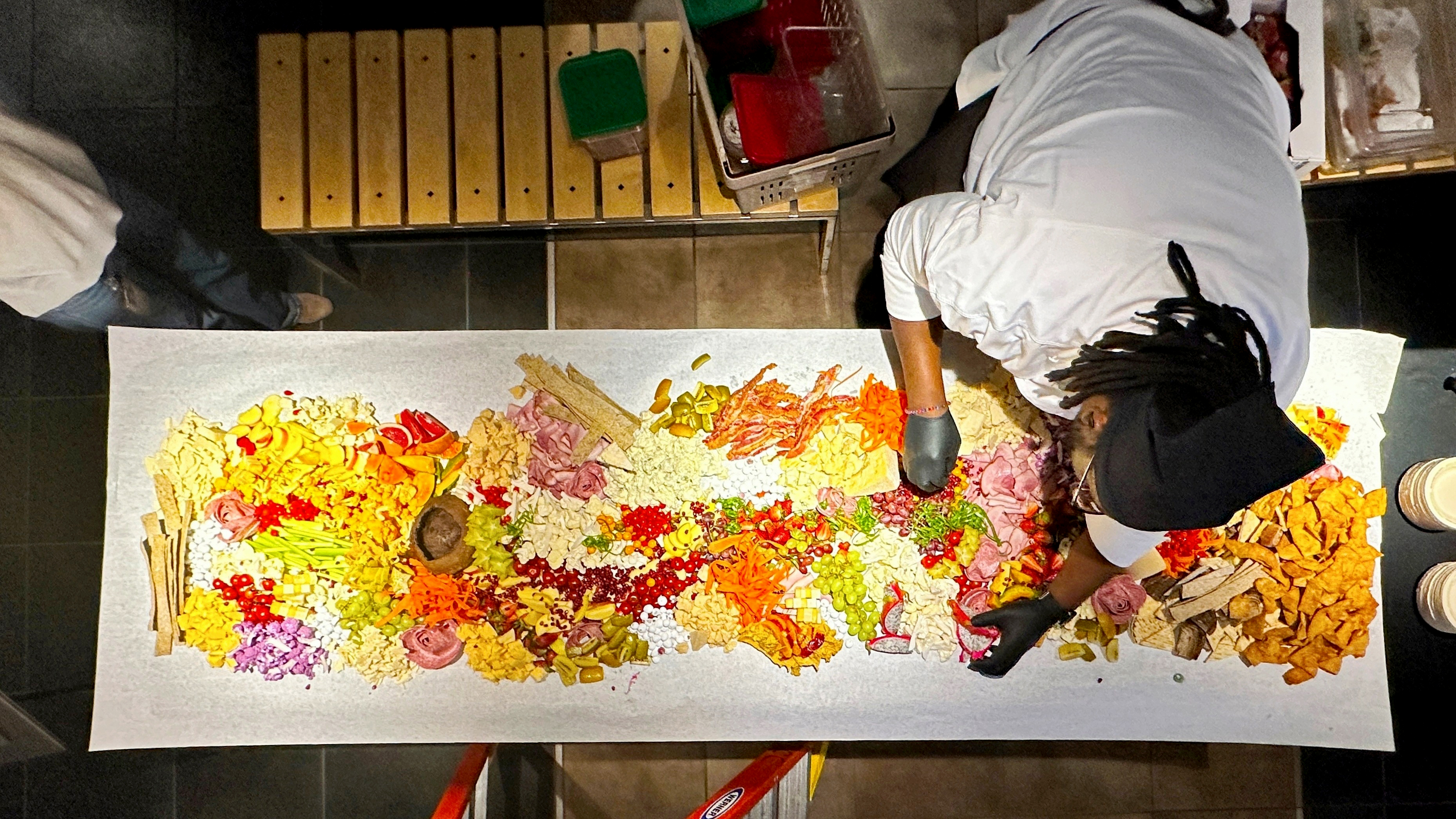 Picture of an artist working on their creation.